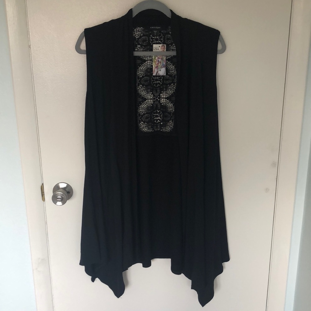 Women’s small black shrug/wrap.